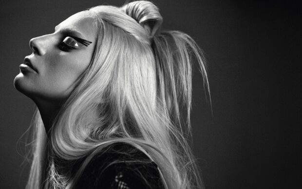 Lady Gaga portrait with dramatic makeup and long flowing hair in black and white