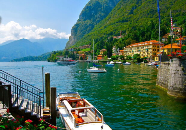 Scenic view of Lake Como with boats and mountains surrounding the peaceful water