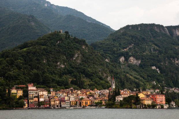 The charming village nestled along Lake Como surrounded by lush green hills