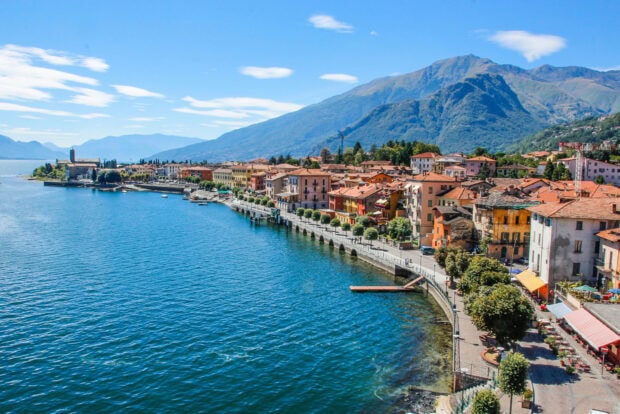 A beautiful view of Lake Como town and mountains under clear blue sky