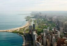 Aerial view of the urban coastline along Lake Michigan with city buildings and greenery