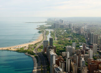 Aerial view of the urban coastline along Lake Michigan with city buildings and greenery