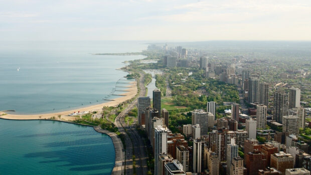 Aerial view of the urban coastline along Lake Michigan with city buildings and greenery