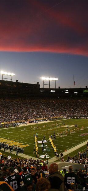 The Lambeau Field crowd and players at sunset before the game starts