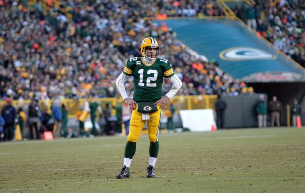 Green Bay Packers player standing on the field at Lambeau Field stadium