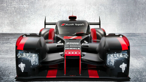 Front view of Audi Le Mans race car with sleek black and red design