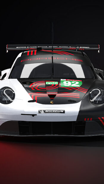 A racing car with Le Mans design featuring the Porsche logo and number 92 on the hood