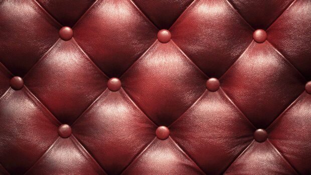 Close up of tufted leather pattern with detailed texture and buttons