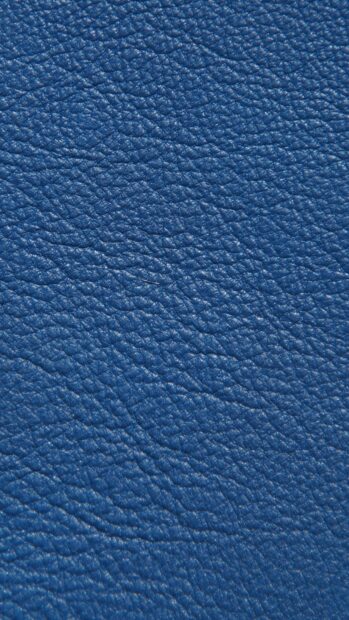 Close up texture of blue leather showing detailed grain pattern