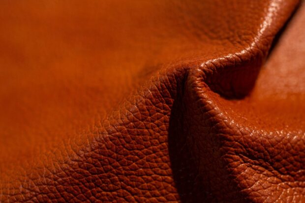 Close up of textured leather showing natural grain and folds