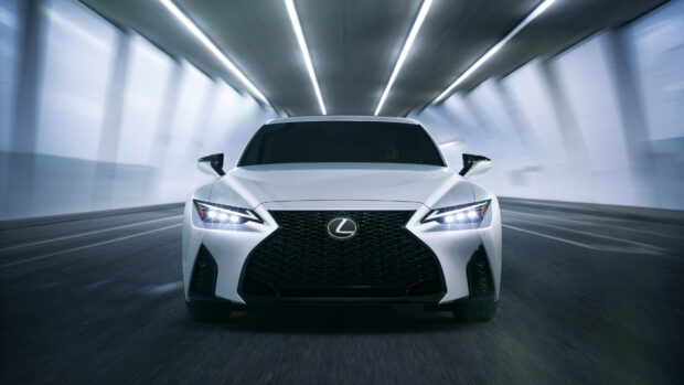 White Lexus luxury car front view in motion inside a futuristic tunnel