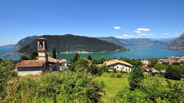 A small village landscape with hills and lake in Lombardy region