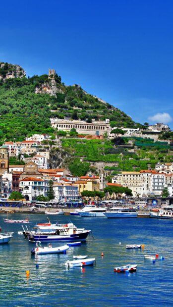 Lombardy Wallpaper HD Mobile Beautiful coastal town with boats in the water and lush green hills in Lombardy region