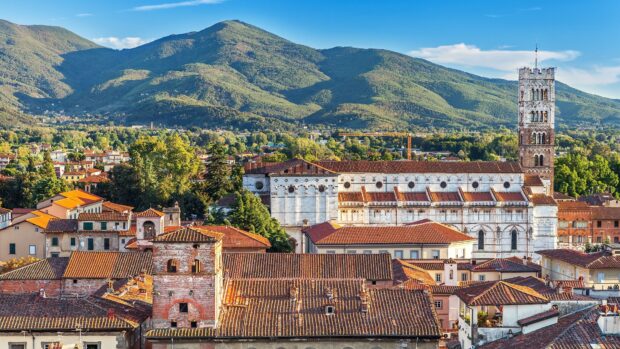 Historic buildings and green hills of Lucca Italy in a scenic landscape