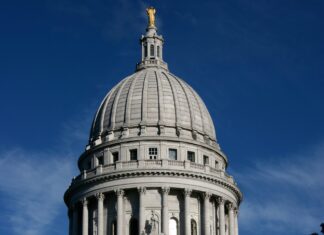 The historic capitol building in Madison Wisconsin with a clear blue sky
