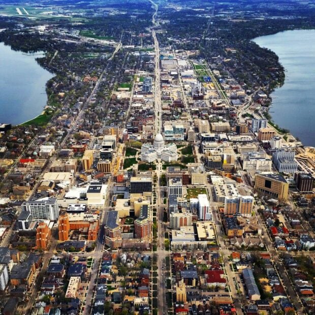Aerial view of Madison city center with Wisconsin State Capitol and surrounding urban area