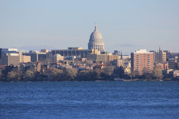 The Madison Wisconsin skyline with the state capitol building viewed across the lake