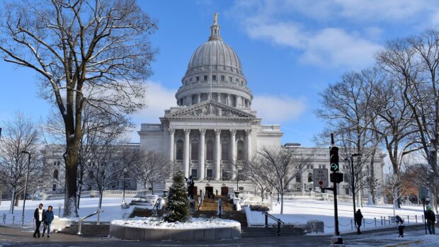 The Capitol building in Madison Wisconsin covered with snow on a clear winter day