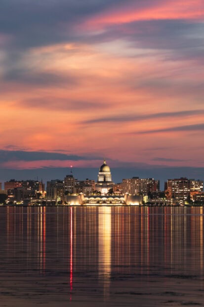 Madison city skyline at sunset with reflections on the lake in Wisconsin