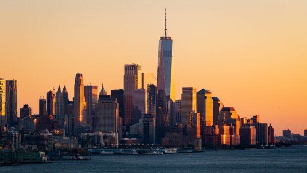 Manhattan skyline during sunset with skyscrapers and water view in Manhattan