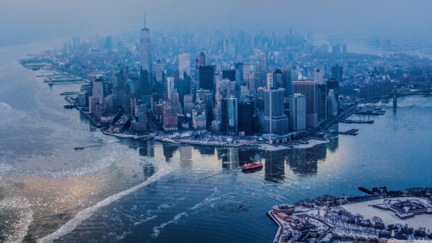 Aerial view of Manhattan with icy river and city skyline in winter with Manhattan