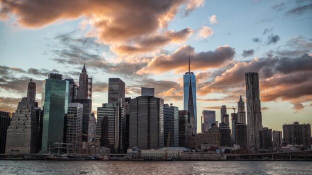 Manhattan skyline featuring iconic buildings and dramatic clouds at sunset in Manhattan