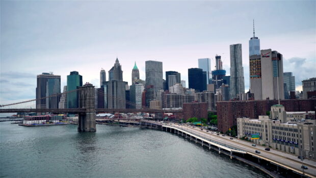 Manhattan skyline featuring the Brooklyn Bridge and cityscape with Manhattan in the background