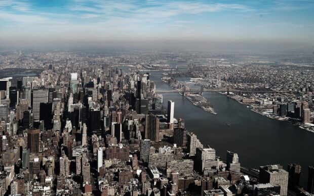 Aerial view of Manhattan showing the cityscape and river with Manhattan in the distance