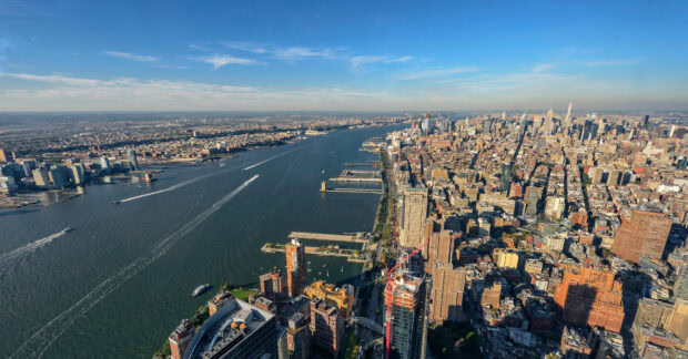 A panoramic view of Manhattan city skyline with Hudson River and urban buildings in Manhattan