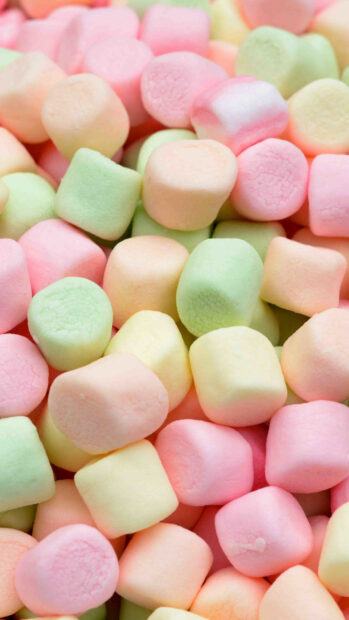 Colorful marshmallow pieces with soft pastel hues piled together