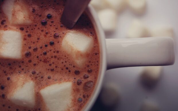 Close up of marshmallow pieces floating in hot chocolate drink