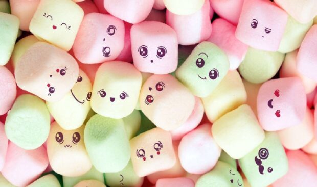 Colorful marshmallow faces with various expressions close up