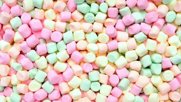Colorful marshmallow sweets scattered in a pile for a vibrant design