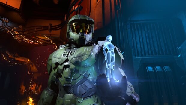 Master Chief holding a holographic character inside a futuristic environment