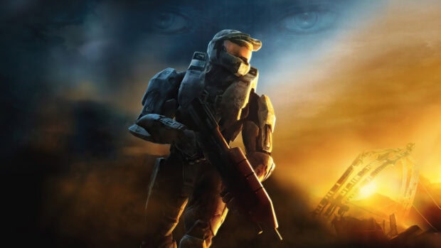 Master Chief standing with a futuristic weapon in a dramatic sunset scene