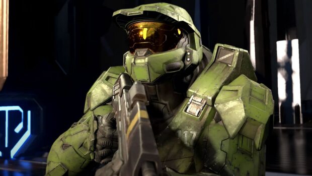 Master Chief in green armor holding a rifle ready for action in a sci fi environment