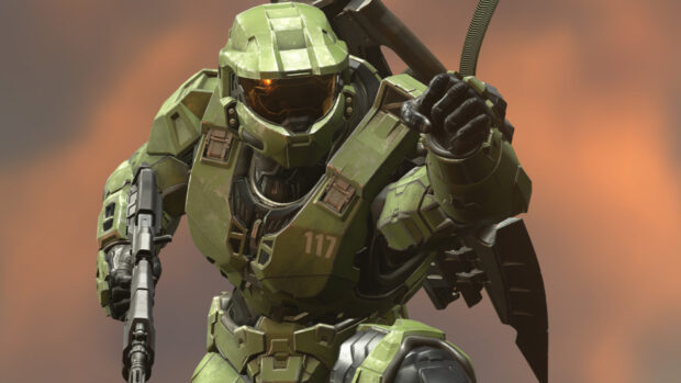 Master Chief is wearing green armor and holding a gun in an action pose