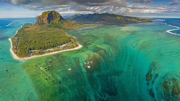 Aerial view of Mauritius Island with turquoise water and lush green landscape