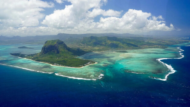 Aerial view of Mauritius Island showcasing vibrant turquoise waters and lush green landscape