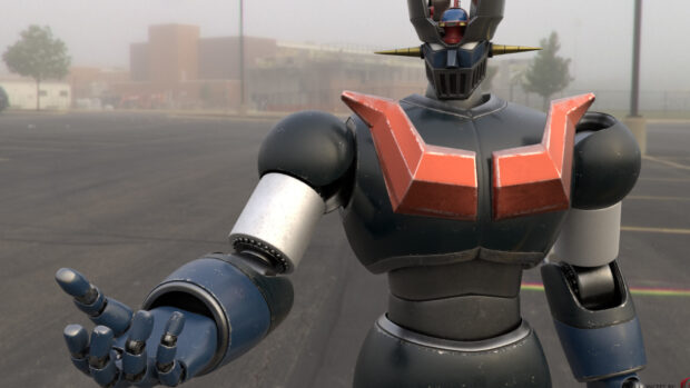 Mazinger Z robot figure with extended hand standing in an empty parking lot