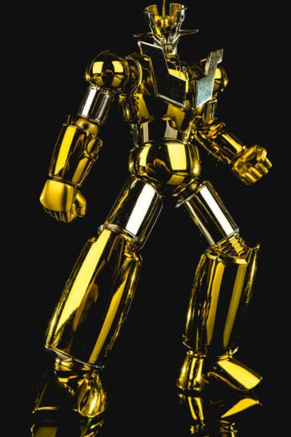 Golden Mazinger Z robot figure standing with shiny metallic gold parts