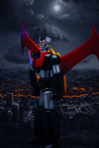 Mazinger Z robot standing over cityscape at night with glowing lights