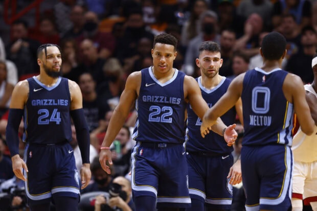 Memphis Grizzlies players celebrating during the basketball game on court