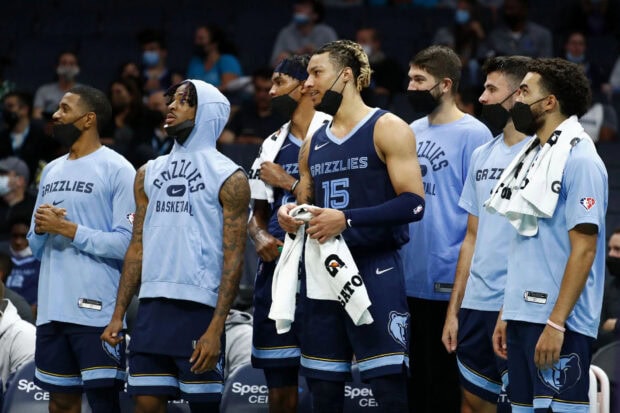 Memphis Grizzlies basketball players standing on the sidelines during the game