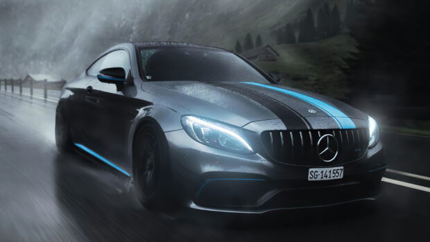 A Mercedes Benz racing car driving fast on a wet road with blue and black stripes