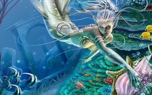 A fantasy mermaid with white hair swimming underwater among colorful coral and fish in a deep sea environment