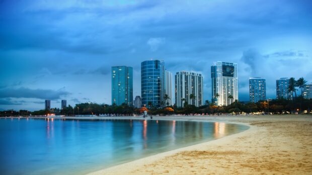 Miami Beach skyline featuring modern buildings and sandy shore at dusk