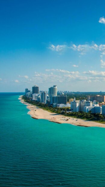 Miami Beach skyline view with clear blue ocean and high rise buildings on a sunny day