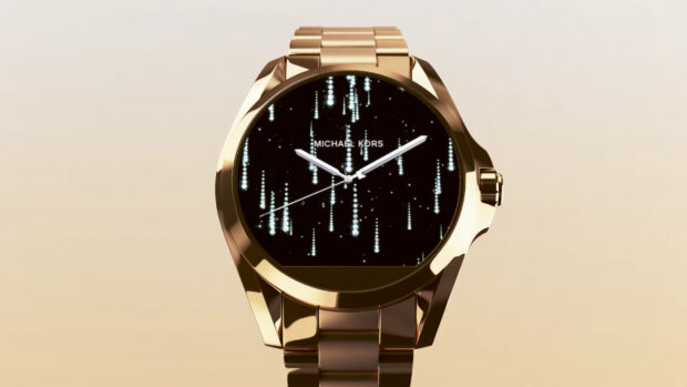 Elegant Michael Kors watch with glowing dial design and gold strap on beige background