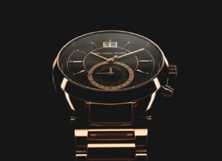 Elegant Michael Kors watch with detailed black and gold design in close up view